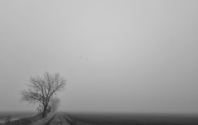 A sad and misty landscape that evokes the feelings expressed in the poem "The Melancholy of Abandoned Hopes"